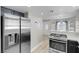 Spacious open concept kitchen with stainless appliances connects to entryway at 1622 Lorna Dr, Henderson, NV 89011