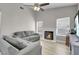 Cozy living room with a fireplace, comfortable seating, and plenty of natural light at 1622 Lorna Dr, Henderson, NV 89011