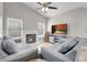 Bright living room features a fireplace, high ceiling, and neutral decor at 1622 Lorna Dr, Henderson, NV 89011