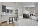 Inviting living space with a breakfast bar, open kitchen, dining area, and a cozy fireplace at 1622 Lorna Dr, Henderson, NV 89011