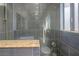 Modern shower featuring dark tiled walls and recessed lighting at 1622 Lorna Dr, Henderson, NV 89011