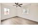 Comfortable bedroom featuring updated flooring, a modern ceiling fan, and ample natural light at 1829 E Saint Louis Ave, Las Vegas, NV 89104
