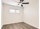 Cozy bedroom featuring updated flooring, a modern ceiling fan, and natural light at 1829 E Saint Louis Ave, Las Vegas, NV 89104