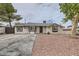 Charming single-story home with gravel yard and large driveway at 1829 E Saint Louis Ave, Las Vegas, NV 89104