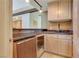 Bar area with under-counter refrigerator and granite counter-tops at 1931 Pago Ct, Las Vegas, NV 89117