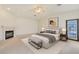 Serene bedroom with a fireplace, a ceiling fan, and a walk-out patio at 1931 Pago Ct, Las Vegas, NV 89117