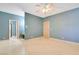 An airy bedroom features stone floors, and an attached bathroom with an extended counter at 1931 Pago Ct, Las Vegas, NV 89117
