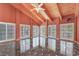 A spacious bedroom with high ceilings, marble floors, and large windows with plantation shutters at 1931 Pago Ct, Las Vegas, NV 89117
