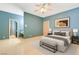 Calm bedroom with a ceiling fan, an ensuite bathroom, and a neutral color palette at 1931 Pago Ct, Las Vegas, NV 89117