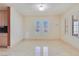 Bright dining area featuring tile floors, neutral walls, and window with plantation shutters at 1931 Pago Ct, Las Vegas, NV 89117