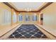 Expansive dining room with windows and a beautiful rug covering the floor at 1931 Pago Ct, Las Vegas, NV 89117