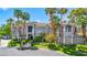 Stunning gray two-story home boasting manicured lawns and palm trees at 1931 Pago Ct, Las Vegas, NV 89117