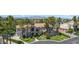 Beautiful view of a two-story house featuring manicured lawns and palm trees at 1931 Pago Ct, Las Vegas, NV 89117