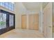Bright foyer featuring tile floors, high ceilings, and an ornate door at 1931 Pago Ct, Las Vegas, NV 89117