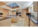 Well-appointed kitchen featuring granite countertops, stainless steel appliances, and a functional island with a cooktop at 1931 Pago Ct, Las Vegas, NV 89117