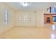 Bright living area featuring tile floors, lots of windows, and an inviting fireplace at 1931 Pago Ct, Las Vegas, NV 89117