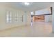 Spacious living room with large windows and built-in shelving, creating an inviting atmosphere at 1931 Pago Ct, Las Vegas, NV 89117
