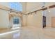 Open living area features tile flooring, high ceilings, and natural light at 1931 Pago Ct, Las Vegas, NV 89117