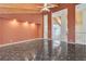 Spacious living room featuring high beamed ceilings, marble floors, and recessed lighting at 1931 Pago Ct, Las Vegas, NV 89117