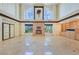 Large living room showcasing a fireplace, built-in shelving, and abundant natural light through multiple windows at 1931 Pago Ct, Las Vegas, NV 89117