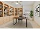 Well-lit office with custom built-in bookshelves and a modern desk setup at 1931 Pago Ct, Las Vegas, NV 89117