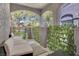 Relaxing outdoor patio featuring cushioned seating and faux decorative vine accents at 1931 Pago Ct, Las Vegas, NV 89117