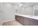 Modern bathroom boasts double sinks, gray cabinetry, and spacious countertop with ample storage at 2238 Thelen Ave, North Las Vegas, NV 89086