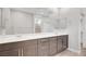 Elegant bathroom features dual sinks with ample counter space and large mirror at 2238 Thelen Ave, North Las Vegas, NV 89086