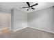 Spacious bedroom with neutral carpet, ceiling fan, and white trim at 2238 Thelen Ave, North Las Vegas, NV 89086
