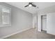 Neutral bedroom has a large window and closet at 2238 Thelen Ave, North Las Vegas, NV 89086