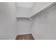 Walk-in closet features neutral carpet, shelves, and metal rods at 2238 Thelen Ave, North Las Vegas, NV 89086