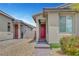 Inviting front entrance featuring a red door and brick walkway at 2238 Thelen Ave, North Las Vegas, NV 89086