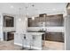 Gourmet kitchen with stainless steel appliances, island with seating, granite counters, and plenty of storage space at 2238 Thelen Ave, North Las Vegas, NV 89086