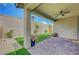 Covered patio area with pavers, a ceiling fan, and backyard access at 2238 Thelen Ave, North Las Vegas, NV 89086