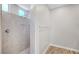 Contemporary tiled shower with modern fixtures and a convenient built-in shelf at 2238 Thelen Ave, North Las Vegas, NV 89086