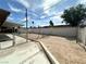 View of the spacious dirt backyard, enclosed by a brick wall at 2300 Pardee Pl, Las Vegas, NV 89104