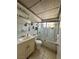 Bathroom with classic decor featuring tile flooring, and decorative shower door at 2300 Pardee Pl, Las Vegas, NV 89104