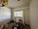 Bedroom view with carpet and lots of toys needing repair at 2300 Pardee Pl, Las Vegas, NV 89104
