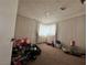 Bedroom view with carpet and lots of toys needing repair at 2300 Pardee Pl, Las Vegas, NV 89104