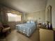 Well-lit bedroom with traditional decor, bright window, and simple furnishings at 2300 Pardee Pl, Las Vegas, NV 89104