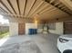 Wide shot of the carport showcasing a parked car and access to the house through a door at 2300 Pardee Pl, Las Vegas, NV 89104