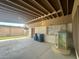 Open carport showing access to house through a gated door, garbage cans, and a religious display piece at 2300 Pardee Pl, Las Vegas, NV 89104