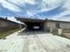 Exterior shot showing the house, driveway, and carport with a white car parked underneath at 2300 Pardee Pl, Las Vegas, NV 89104