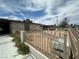 Side view of single-story house with xeriscaped front yard and decorative metal fence at 2300 Pardee Pl, Las Vegas, NV 89104