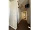 Hallway featuring carpet, paneling and damaged ceiling at 2300 Pardee Pl, Las Vegas, NV 89104