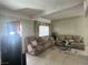 Cozy living room features comfortable seating, large windows, and classic decor at 2300 Pardee Pl, Las Vegas, NV 89104