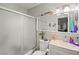 Bright bathroom featuring a shower-tub combo and a vanity with stylish decor at 251 Las Palmaritas Dr, Las Vegas, NV 89110