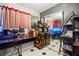 Eclectic bedroom featuring mirrored closet doors and vintage arcade game consoles at 251 Las Palmaritas Dr, Las Vegas, NV 89110