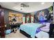 Unique bedroom with a ceiling fan, large bed, and quirky wall decorations at 251 Las Palmaritas Dr, Las Vegas, NV 89110