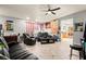 Spacious living room featuring tile floors and comfortable seating, flowing into the adjacent kitchen at 251 Las Palmaritas Dr, Las Vegas, NV 89110